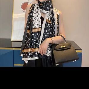 Elegant Black and White Scarf with Gold Accents